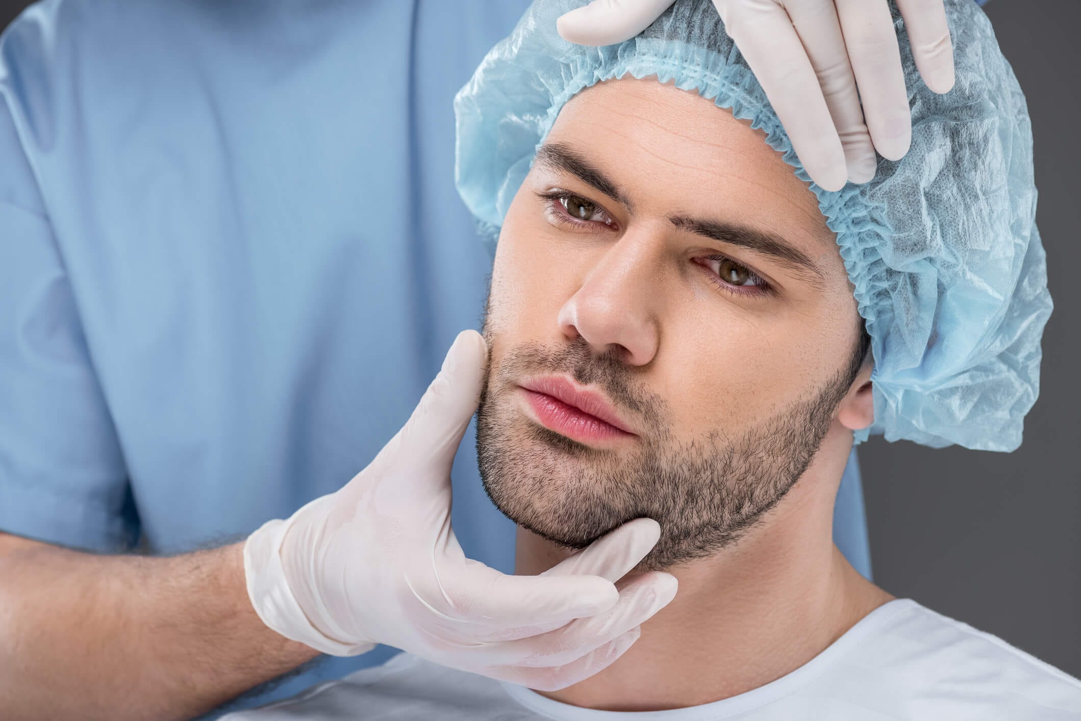 Dr. George Brennan doing a male facelift in Newport Beach, California at Dr. George Brennan's clinic