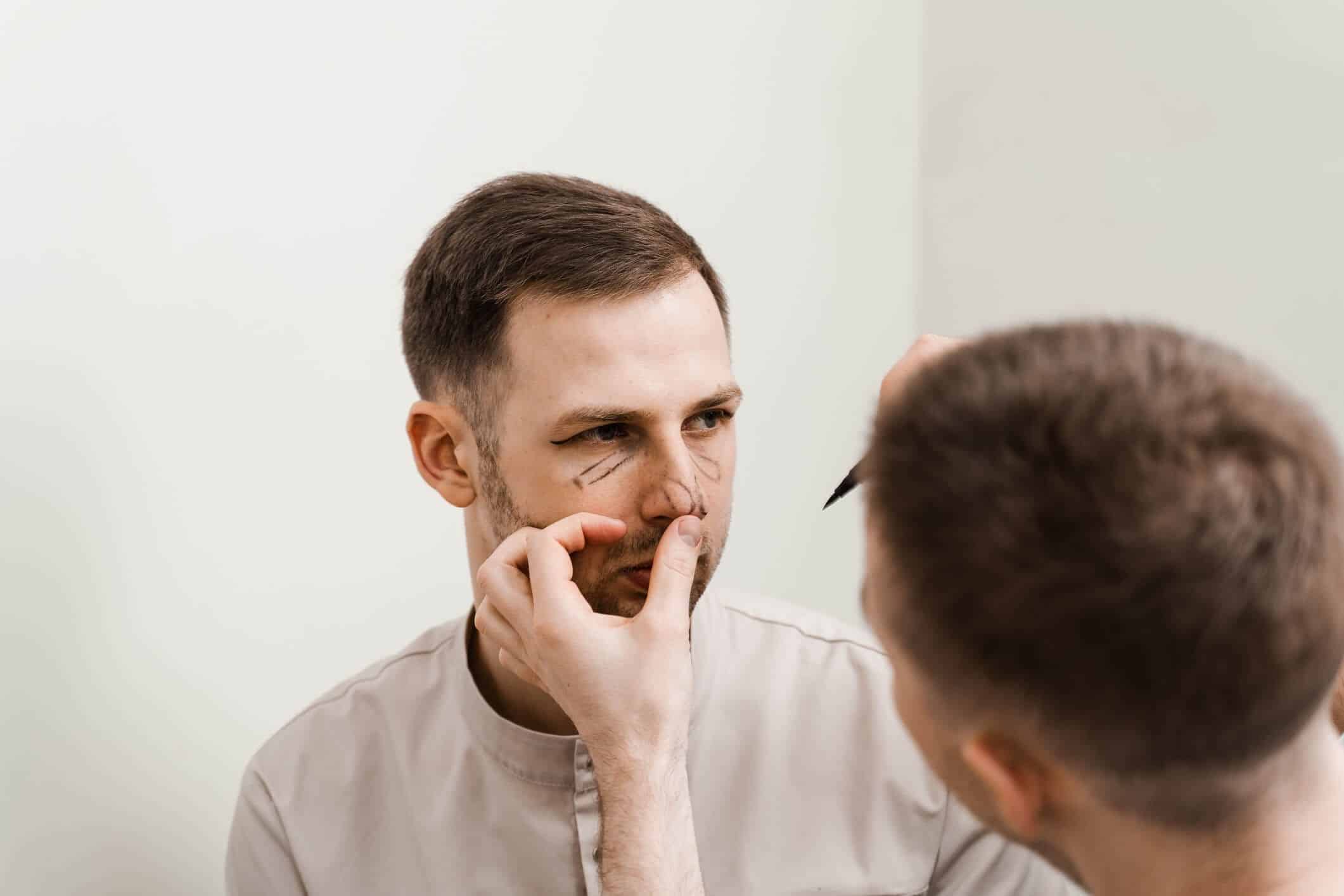 Male rhinoplasty by Dr. George Brennan in Orange County, California for enhanced facial features.