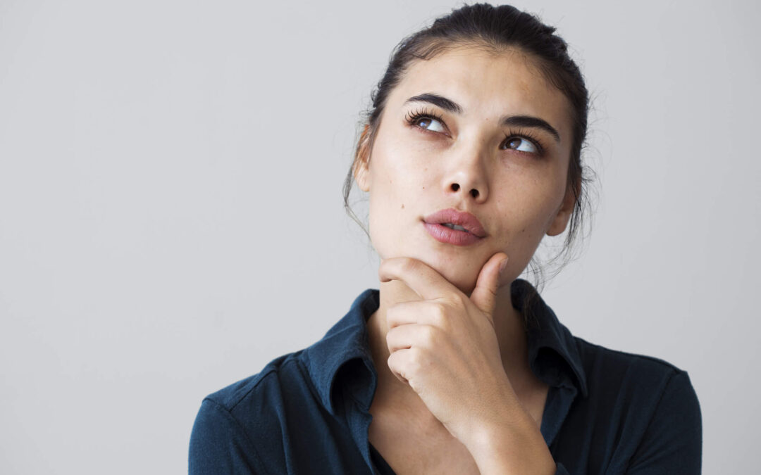 A patient sits in Dr. George Brennan’s office in Orange County California while discussing rhinoplasty options and expectations.