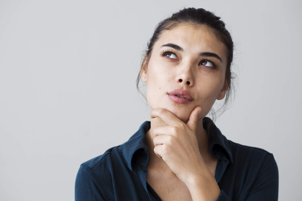 A patient sits in Dr. George Brennan’s office in Orange County California while discussing rhinoplasty options and expectations.